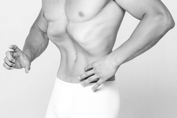 Man slim stomach. Naked male torso. Fitness and healthy lifestyle. Males underwear - Fotoğraf, Görsel