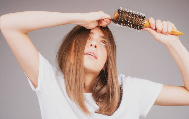 Woman worried about hair loss. Hair fall problem - Foto, imagen