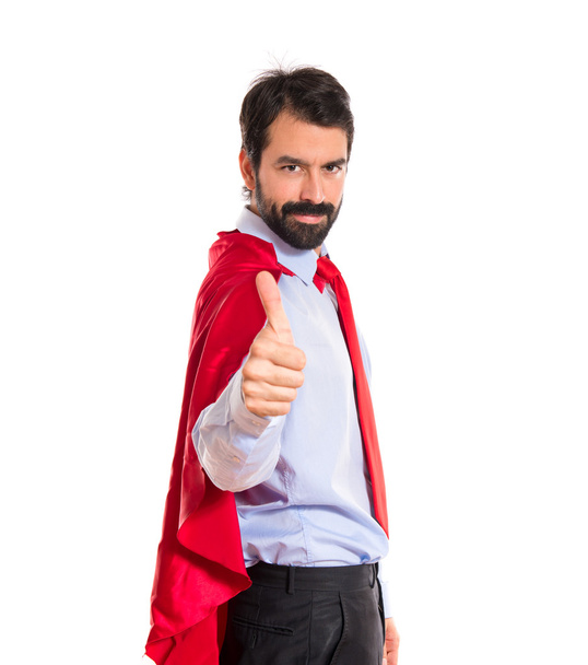 Businessman dressed like superhero with thumb up  - Photo, Image