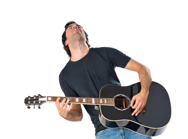 Handsome man with guitar over white background - Photo, Image