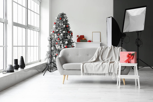 Interior of modern photo studio decorated for Christmas - Foto, Imagen