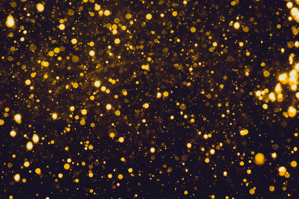 Abstract gold bokeh with black background - Photo, Image