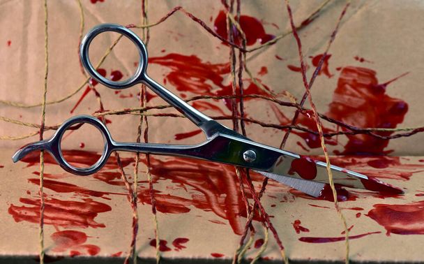 scissors with thread and blood - Photo, Image
