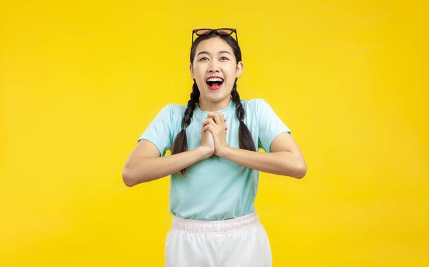 Photo of Young Asian Woman over isolated yellow background, fashion and lifestyle summer concept - Fotografie, Obrázek