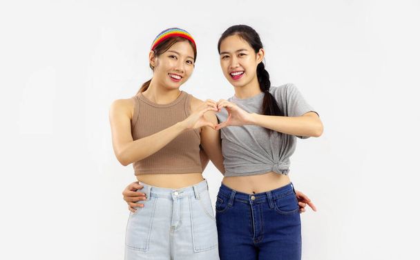 Happy Two Young asian women making hand heart, concept of lgbt couple isolated on white background. - Фото, изображение