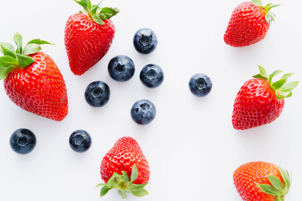 Top view of fresh berries on white background  - Foto, Bild