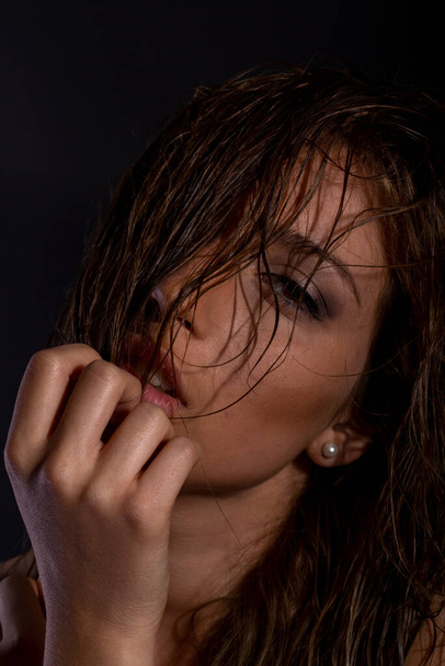 beautiful italian brunette girl portrait posing in studio with wet hair and bra. High quality photo - Фото, изображение