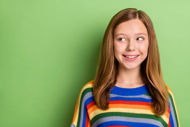 Portrait of attractive cheerful sweet minded girl thinking copy blank space solution isolated over bright green color background. - Foto, immagini