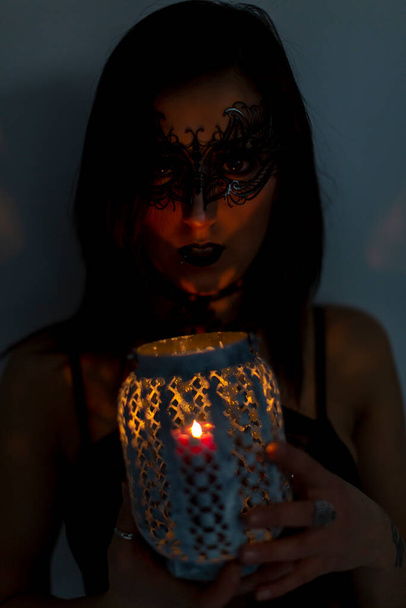 beautiful girl with mask and lantern in hand. High quality photo - Photo, Image