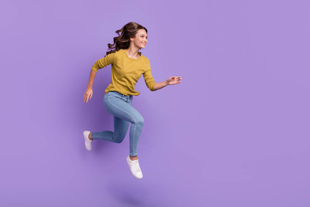 Full body profile photo of cheerful pretty lady look empty space run fast isolated on purple color background. - Fotografie, Obrázek
