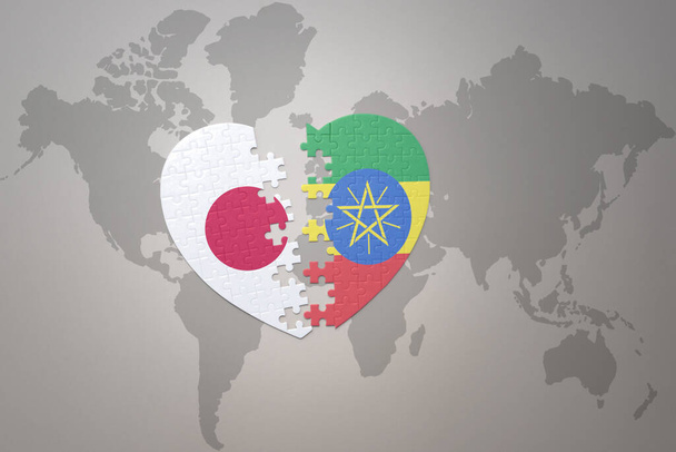 coração de quebra-cabeça com a bandeira nacional do japão e etiópia em um fundo de mapa do mundo. Conceito. Ilustração 3D - Foto, Imagem