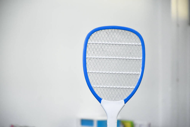 Electronic mosquito swatter in the office room for killing mosquitoes and insects inside the office, soft and selective focus. - Foto, imagen