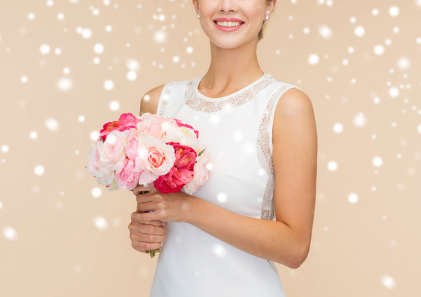 close up of woman in white dress with flowers - Zdjęcie, obraz