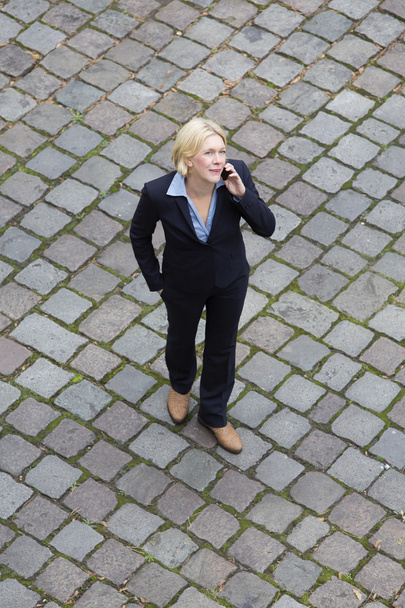 bird's-eye view of a businesswoman in the street on the phone - Fotoğraf, Görsel