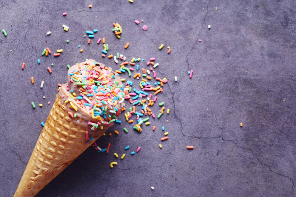  top view of cone ice cream on a black background . - Zdjęcie, obraz
