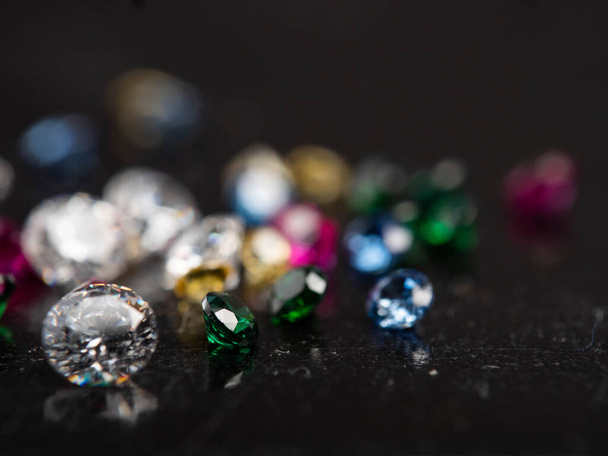 Close up shot of group multi colors diamond on a black background - Photo, Image