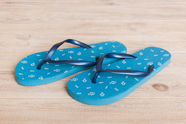 Beach accessories. Flip flops and starfish on colored background. Top view Mock up with copy space. - Fotografie, Obrázek