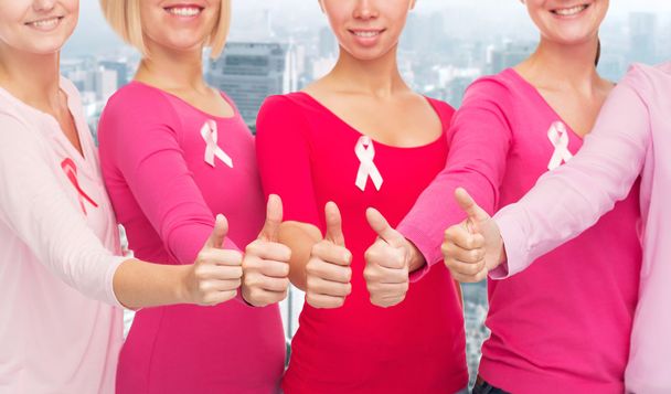 close up of women with cancer awareness ribbons - Photo, Image