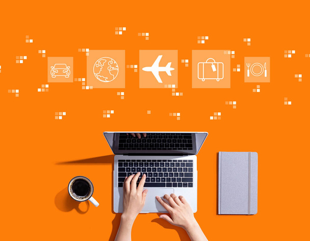 Airplane travel theme with person using a laptop computer - Φωτογραφία, εικόνα