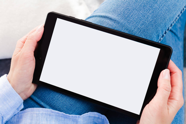Womens hands holds digital tablet with blank white desktop screen. Tablet blank screen mockup. Close-up. Place for text. - Foto, afbeelding