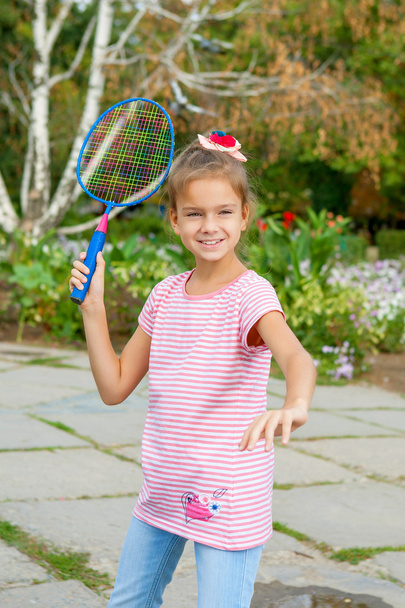 Cute girl with racket Outdoors - Φωτογραφία, εικόνα