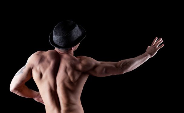 Nude muscular athletic man pose in dark - Fotoğraf, Görsel
