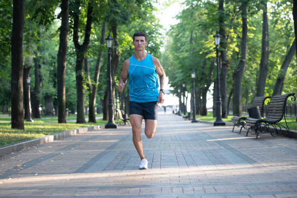 athletic man runner jog in sportswear outdoor. - Foto, afbeelding