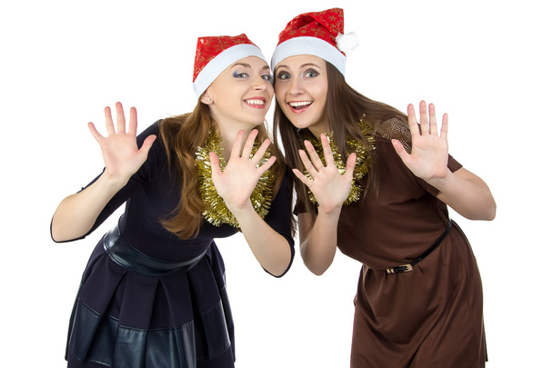 Imagen de dos jóvenes felices con sombreros de navidad
 - Foto, Imagen