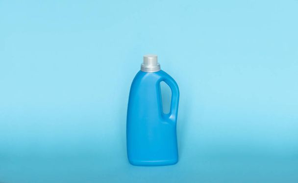 Blue plastic bottles of cleaning products. Laundry container, merchandise template - Fotó, kép