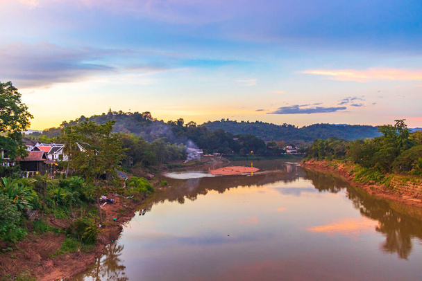 Sunset at panorama of the landscape Mekong river and Luang Prabang city in Laos world tour in Southeast Asia. - 写真・画像