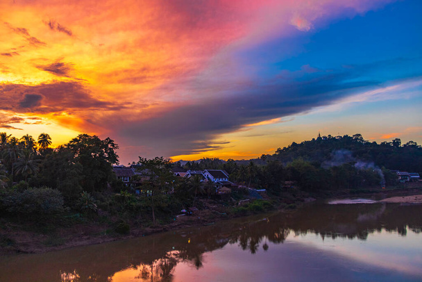 Sunset at panorama of the landscape Mekong river and Luang Prabang city in Laos world tour in Southeast Asia. - Photo, image