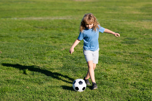 Soccer boy, child play football. Boy kicking football ball. Training for sport children - Фото, зображення