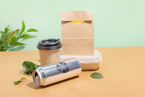protect earth and environment concept, paper cup and paper can, paper packages and plants - Foto, immagini