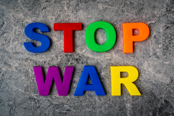 The inscription Stop War in plastic letters on a stone background. Stop war, stop aggression. - Fotoğraf, Görsel