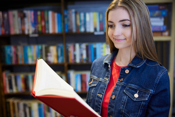 Young Woman Or Student Browsing Books In Book Store - Photo, Image