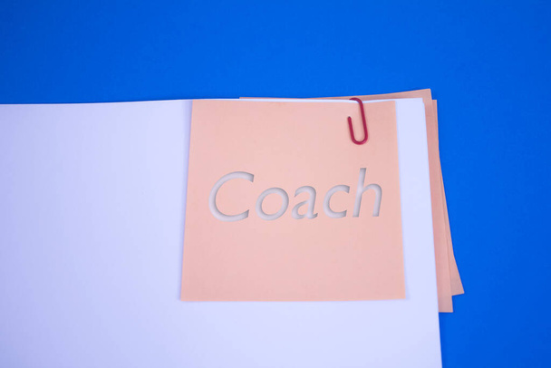 Coach. Text on adhesive note paper. Event, celebration reminder message. - Photo, Image