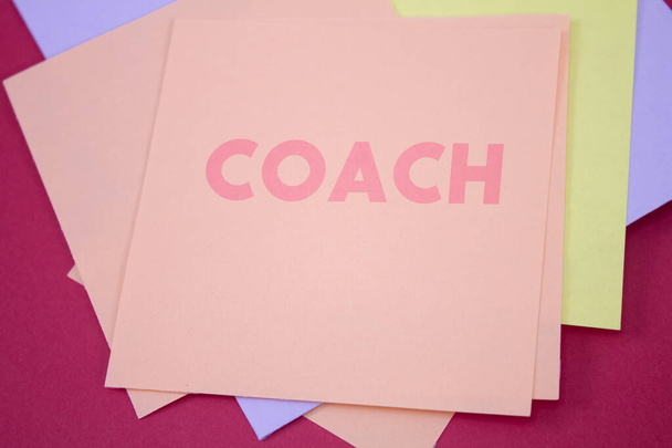 Coach. Text on adhesive note paper. Event, celebration reminder message. - Photo, Image