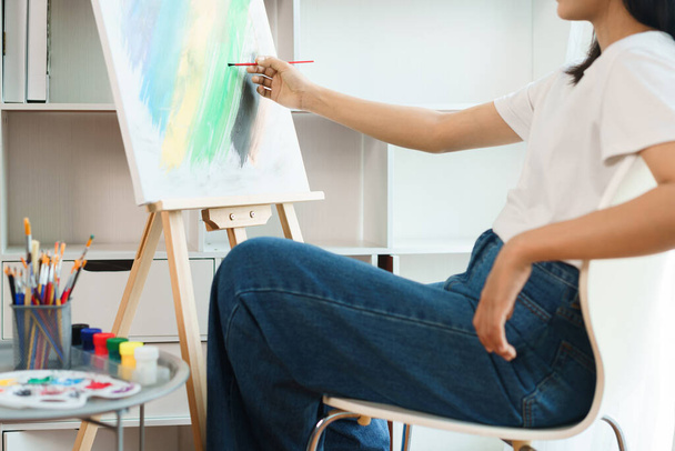 The art concept, Asian female artist use paintbrush to drawing artwork on canvas in art studio. - Φωτογραφία, εικόνα