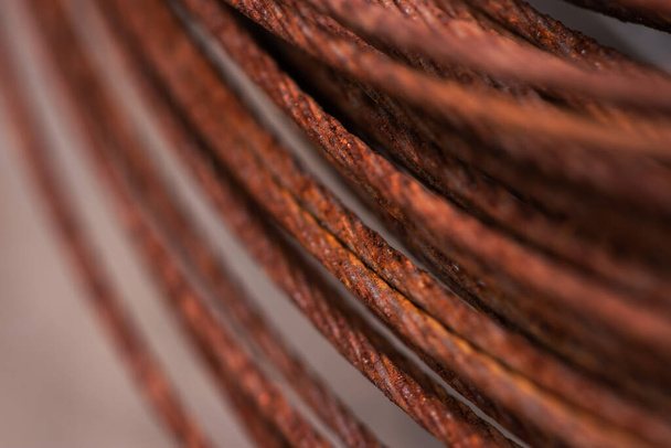 Round rusty steel wire coils. Metal reels for further industrial processing - Fotoğraf, Görsel
