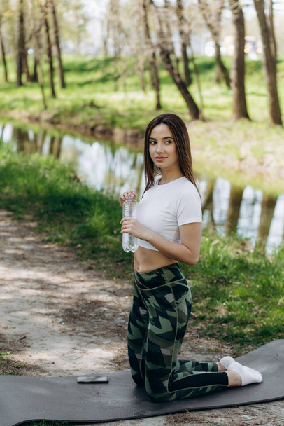 Young sport girl do yoga in the park, asian beauty woman - Valokuva, kuva