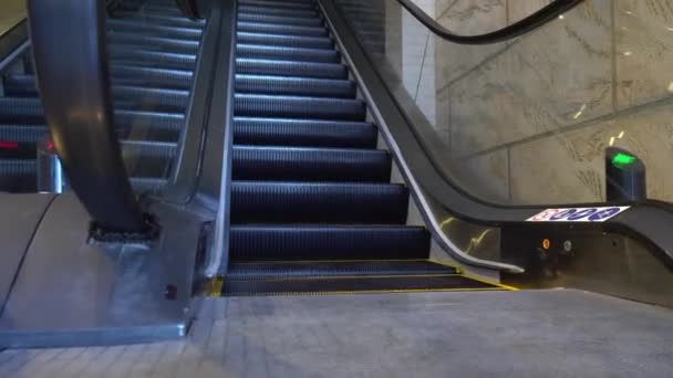 Empty escalator with no people working in mall. Epidemic or quarantine. Opening new escalator or moving staircase. Camera movement, dynamic shooting. - Video