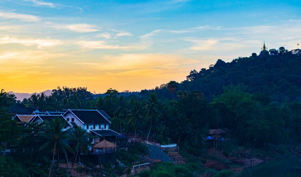 Sunset at panorama of the landscape Mekong river and Luang Prabang city in Laos world tour in Southeast Asia. - Fotoğraf, Görsel