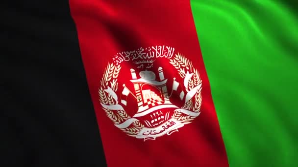 Afganistanın üç renkli bayrağı. Hareket. Parlak bir tuval, ortasında beyaz desenli ulusal bir sembol. Yüksek kalite 4k görüntü - Video, Çekim