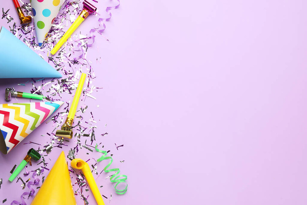 Beautiful flat lay composition with festive items on violet background, space for text. Surprise party concept - Foto, Bild