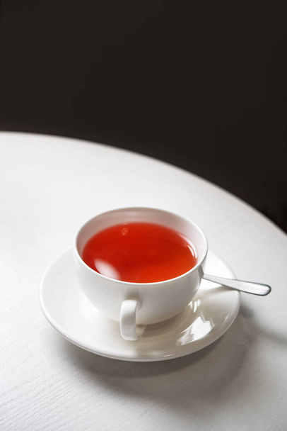Red fruit tea in a white wooden table in cafe  - Fotografie, Obrázek