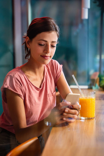 Portrait of happy young woman using smartphone. People mobile phone connection work concept - Photo, image