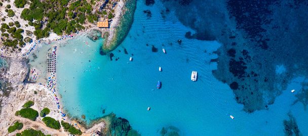 Cost of Sardinia: Peninsula of Punta Molentis. View of beautiful beach at Punta Molentis, Villasimius, Sardinia, Italy. Beautiful bay with sandy beach at Punta Molentis, Sardinia island, Italy. - Photo, image