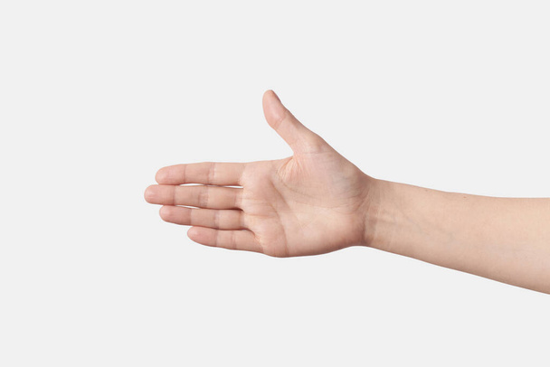 Female wide open wrist, hand reaching for a handshake with a thumb up, isolated on white background. - 写真・画像