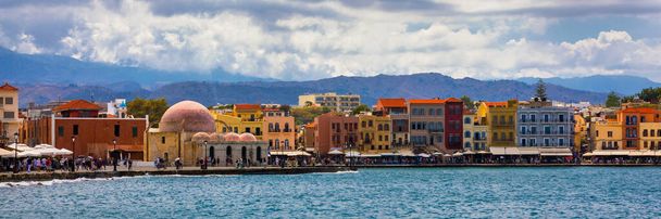 Mosque in the old Venetian harbor of Chania town on Crete island, Greece. Old mosque in Chania. Janissaries or Kioutsouk Hassan Mosque in Chania Crete. Turkish mosque in Chania bay. Crete, Greece. - Photo, Image