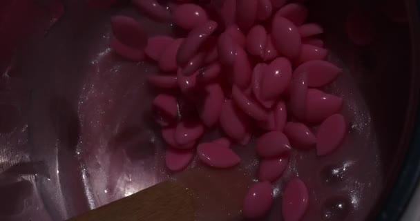 Preparation of pink wax for shugaring. Close-up wax for depilation. - Footage, Video